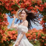 Nàng thơ giữa vườn hoa màu cam và bầu trời xanh sống động dịu dàng mùa hè